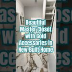 Beautiful Master Closet in New Built Home with Gold Accessories
